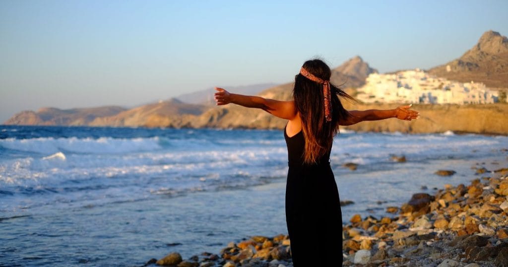 Woman on beach symbolising emotional freedom, confidence, and self-worth after RTT hypnotherapy