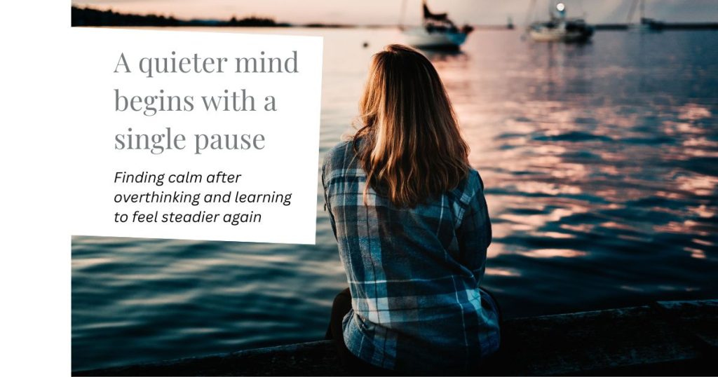 Person sitting quietly by calm water at sunset, symbolising clarity and peace after overthinking and RTT hypnotherapy.